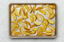 Completed burger with potato wedges